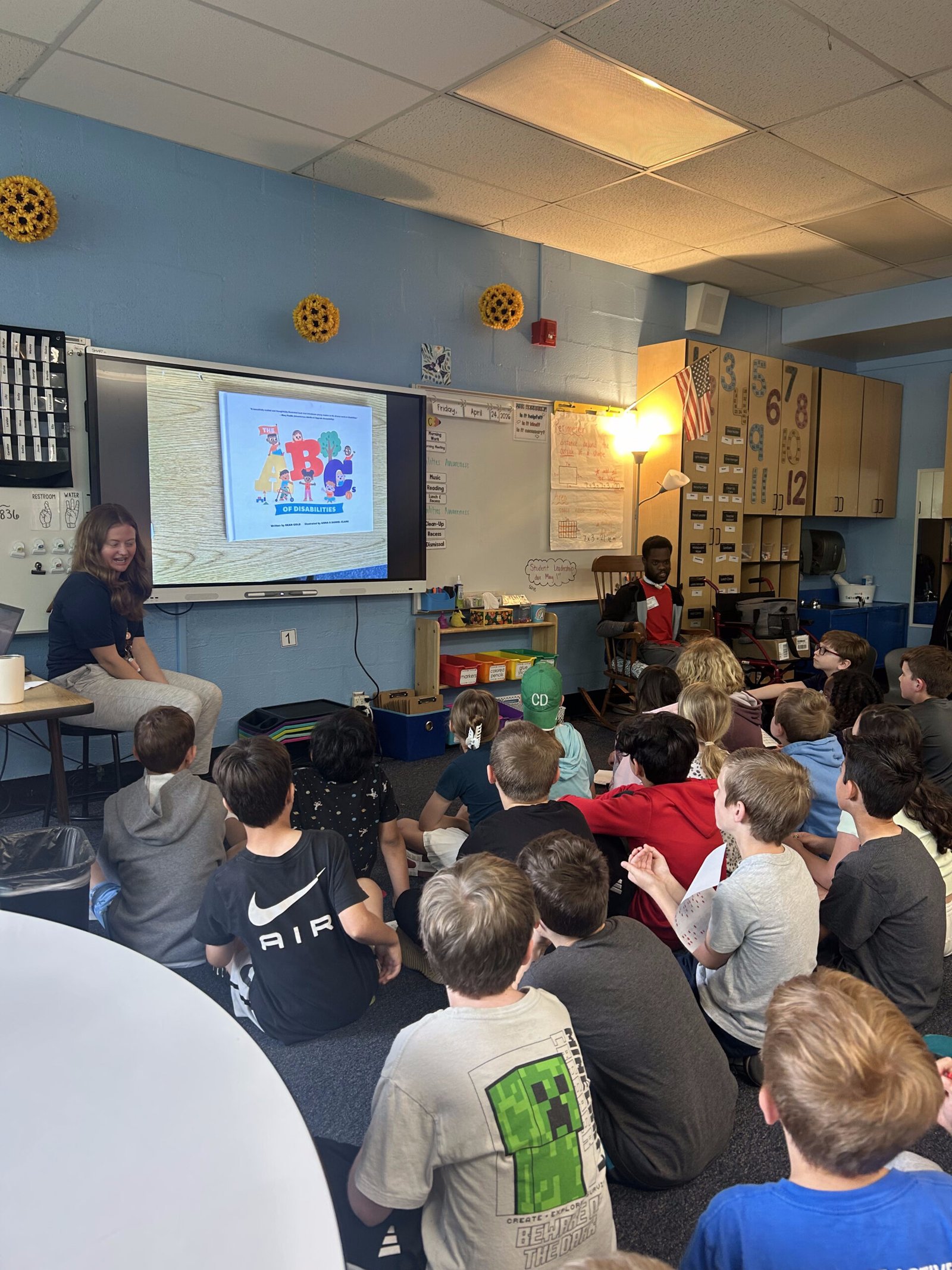 Sean Gold during a school author visit, reading to a classroom
